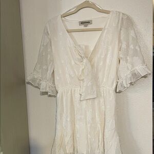 Chic Ivory Short Jumper with Ruffle Accents